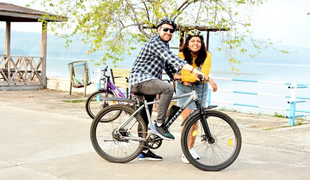 River Front Couple Cycling-